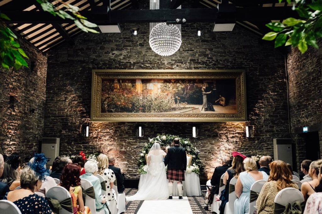 A bride and groom in a grand setting