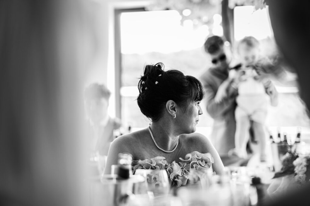 A black and white image of a wedding guest a table