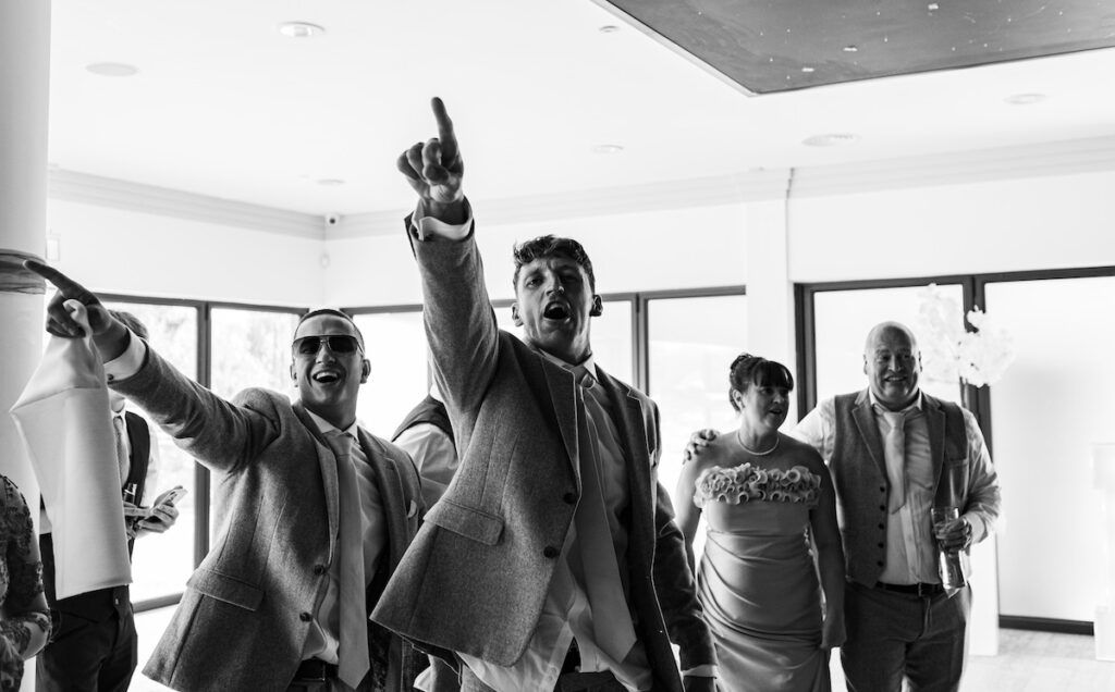 Wedding guests dancing black and white