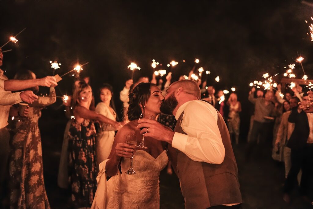 A couple kiss with sparklers