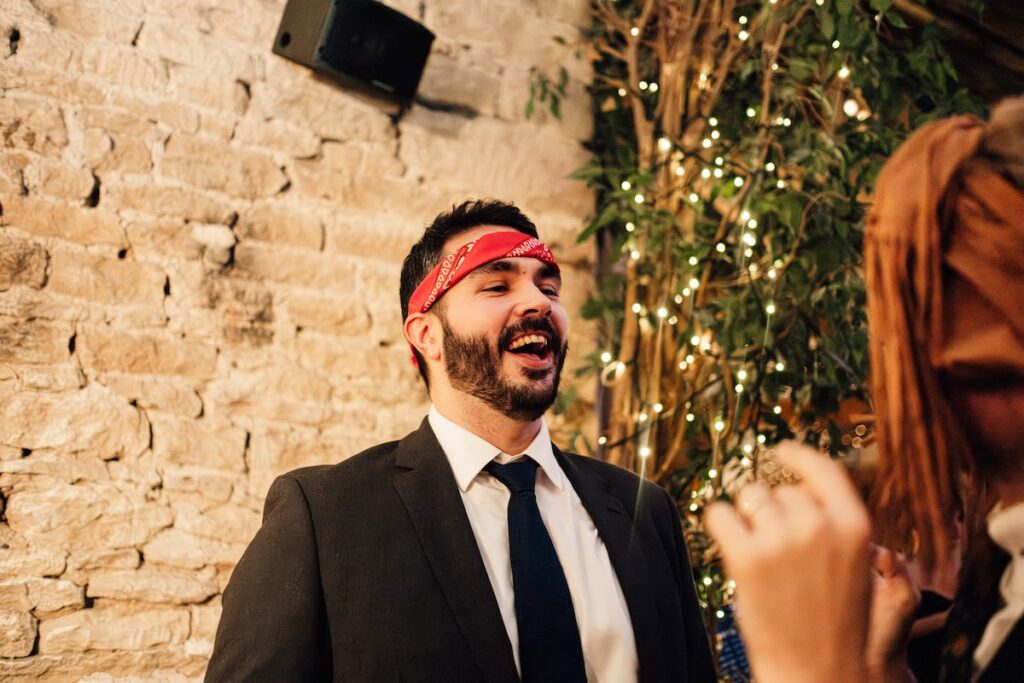 A guest with a tie around his head