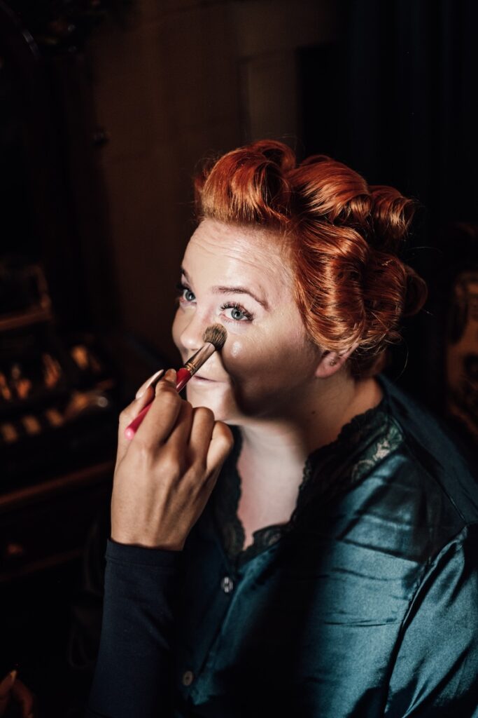Bride having make-up applied