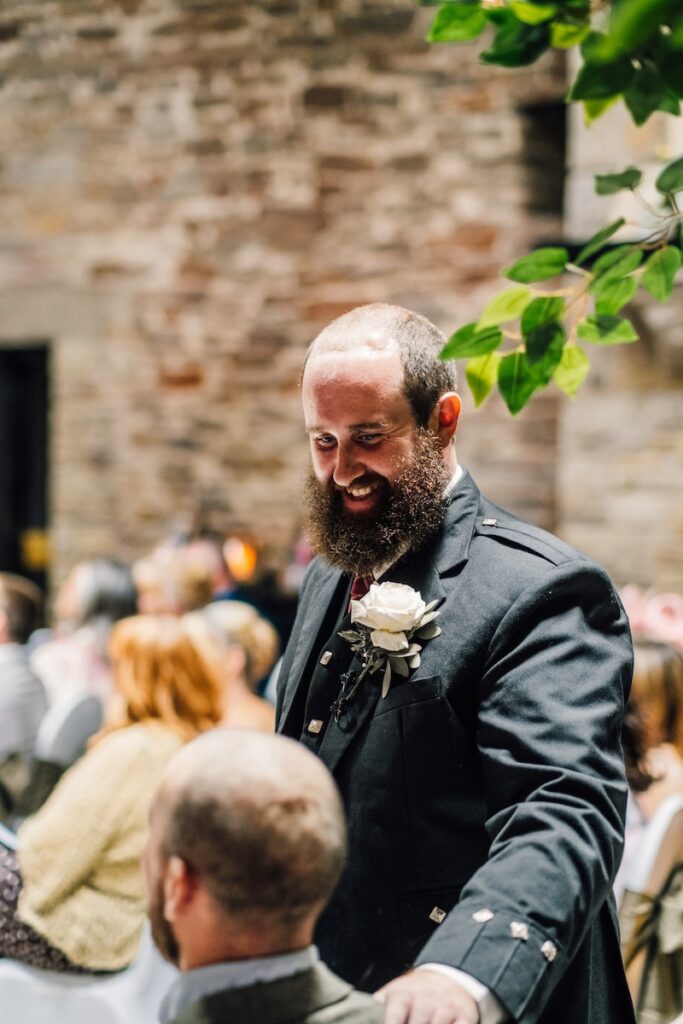 The groom chatting and laughing
