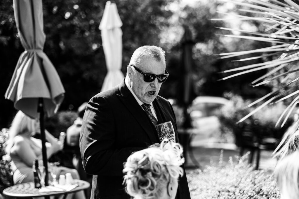 Wedding guest with sunglasses in black and white