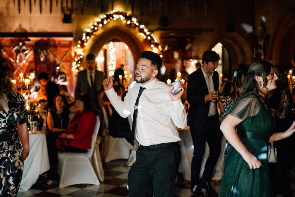 A wedding guest dancing
