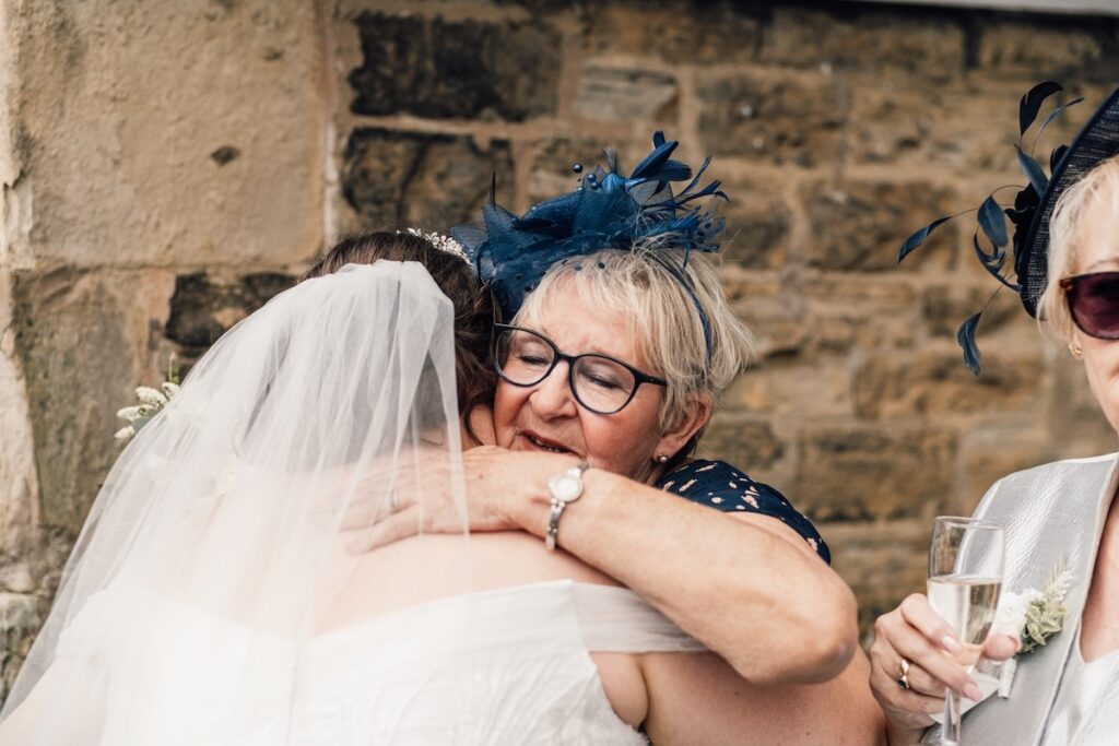 A guest embracing the bride