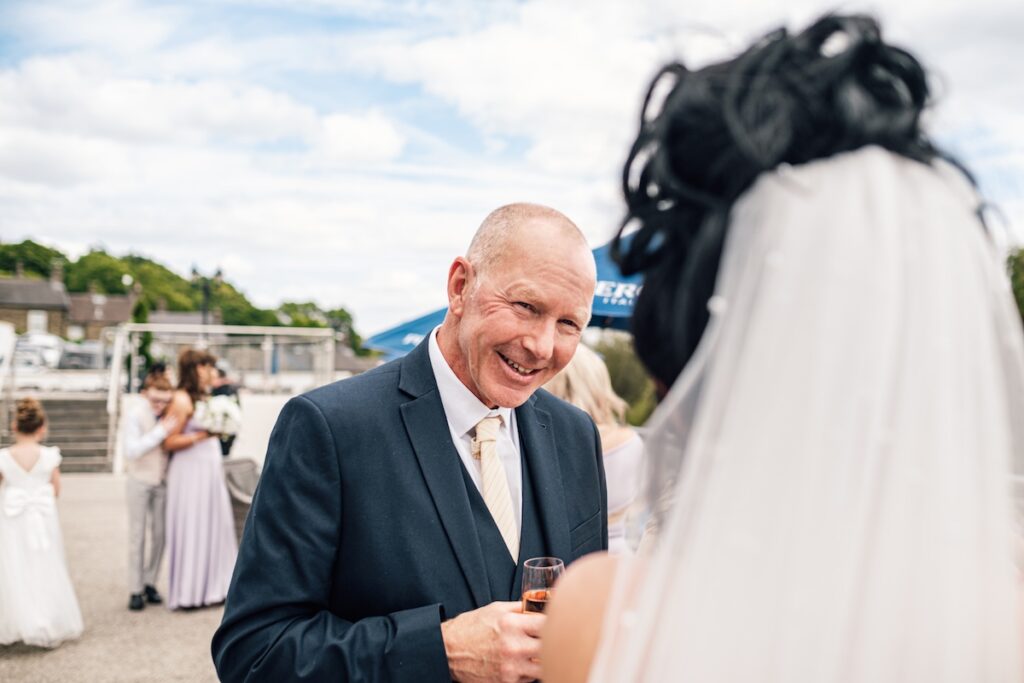 Wedding guest with a blue sky