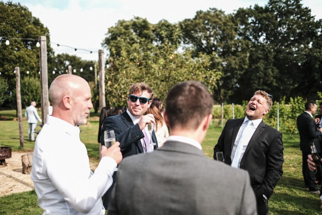 Wedding guests laughing candidly