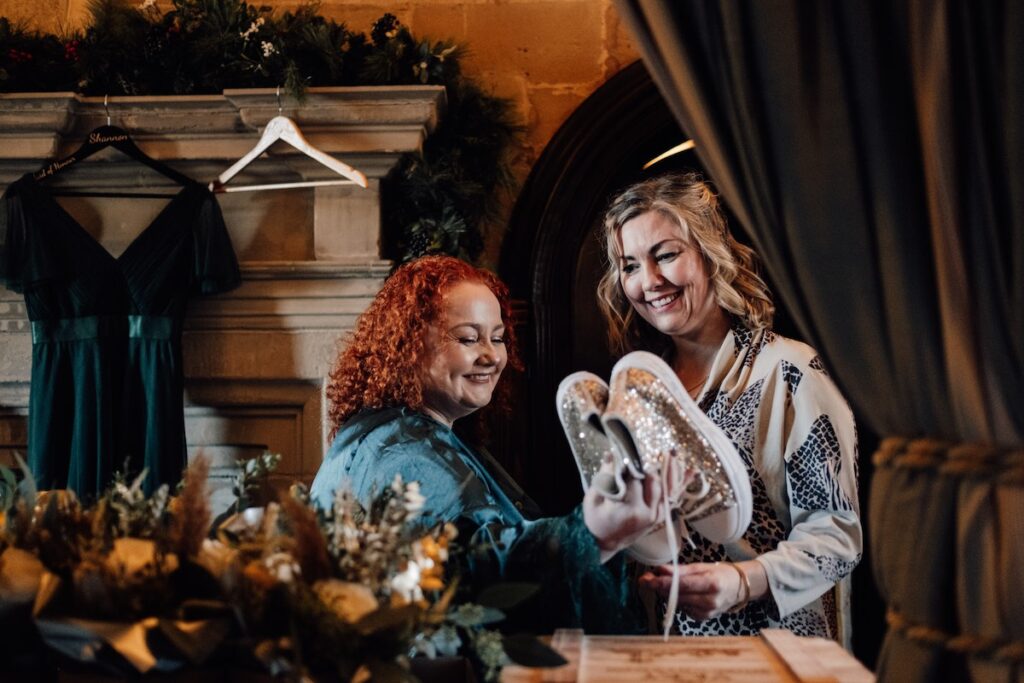 Proud mother with wedding shoes