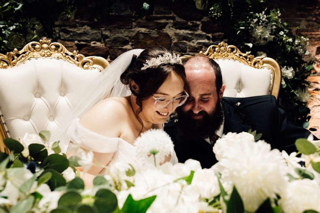 Bride and groom signing the register